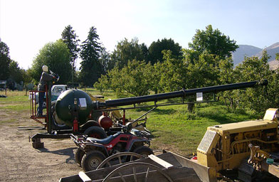 
                    To drum up business around apple harvest and pumpkin season, Thompson loads up this cannon and shoots pumpkins hundreds of yards into a nearby hillside.
                                            (John Moe)
                                        