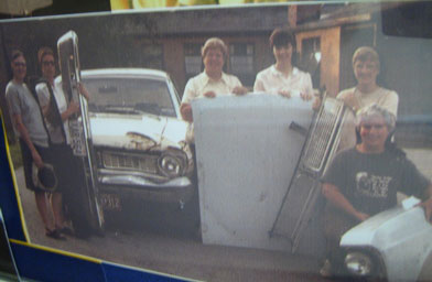 
                    The Sisters of St. Francis back in the 1980s, when they were fixing up an old car.
                                            (Kelly McEvers)
                                        