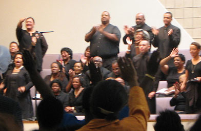 
                    Members of The Church of The Lord in Akron, Ohio, react to the day's sermon with the choir.
                                            (Mhari Saito)
                                        