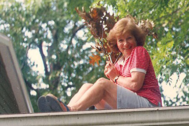 
                    Debbie Samuels' mother Ruth Slutsky perched on the garage roof of the family's home in New Haven for her annual gutter cleanup and early leaf quest.
                                            (Debbie Samuels)
                                        