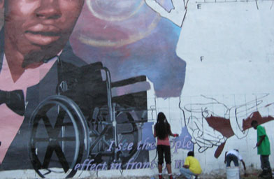 
                    Neighborhood kids from North Philadelphia painting the Forgiveness Project mural at 13th Street and Erie Street.  The mural is a creation of the Mural Arts Program and directed by artist Eric Okdeh.
                                            (Eric Okdeh)
                                        