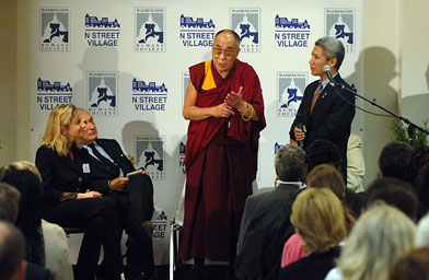 
                    The Dalai Lama flanked Lisa LaFontaine (L) president and CEO of the Washington Humane Society , Jim Wolfensohn (2nd-L) former president of the World Bank Group and interpertor Thupten Jinpa (R).  They listen as the Dalai Lama speaks of compassion at N Street Village during a visit October 19, 2007 in Washington, DC.
                                            (Tom Brown/Getty Images)
                                        