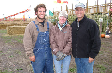 
                    Aaron Peterson, Nicola Peterson and Sever Peterson pose in front of the maze entrance. Sever and his wife Sharon started the maze 11 years ago after a trip they took to England. They were inspired by the mazes they saw and wanted to create a maze in their hometown.
                                            (Angela Kim)
                                        