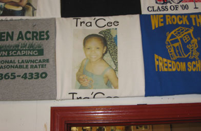 
                    Close-up of a memorial t-shirt hanging on the wall of the shop.
                                            (Maria Carter)
                                        