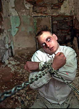 
                    During Halloween at the old Eastern State Penitentiary, the former prison becomes a haunted house.  In the attraction "Intake," a ghost inmate is chained to the walls. Or is he?
                                            (Andrew Garn)
                                        