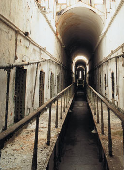 
                    When Eastern State Penitentiary opened in 1829, visitors from around the world marveled at its grand architecture and radical philosophy.  With its high, arched corridors and more than 1,000 skylights, the penitentiary feels like a religious space, rather than a prison.
                                            (Elena Bouvier, 1998)
                                        