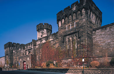 
                    Eastern State Penitentiary's Board of Commissioners hoped the building's grim fa&ccedil;ade would instill fear in the hearts of lawbreakers. "The exterior of a solitary prison should exhibit, as much as possible, great strength, and convey to the mind... the misery which awaits the unhappy being who enters within its walls." Book of Minutes of the Board of Commissioners.  March 26, 1822.
                                            (Albert Vecerka)
                                        