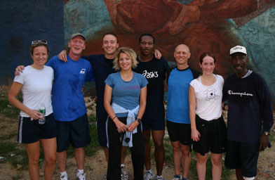 
                    Following an early morning run the crew feels the afterglow.  Volunteers and residents Jessica Doty, Gene Katze, Andy Marr, Back On My Feet founder Anne Mahlum, Abdullah Dorah, Stuart Napshin, Elizabeth Campbell and James Shepherd.
                                            (Wylie Belasik)
                                        