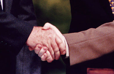 
                    Israeli Prime Minister Yitzhak Rabin (L) and Palestine Liberation Organization Chairman Yasser Arafat (R) shake hands September 13, 1993 at the White House, Washington, D.C. after an accord was signed granting the Palestinians limited self-rule in the Gaza Strip and in the West Bank city of Jericho.
                                            (PAUL J. RICHARDS/AFP/Getty Images)
                                        