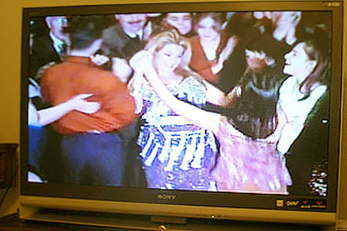 
                    One video the Augustin family brought with them to the United States.  They left Iraq for Jordan about three years ago and came to Detroit in 2006.  This scene is from a New Year's Eve party in Iraq in 2003.
                                            (Kara Oehler)
                                        