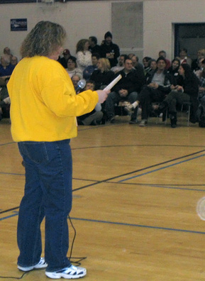 
                    Did you hear the one about the Dodd Volunteer? The Iowa City Precinct 6 Caucus captain "warms up" the crowd.
                                            (Kyle Gassiott)
                                        