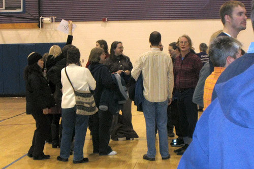 
                    Dennis Kucinich's supporters gather in the middle of the floor holding up a handmade sign with his name.
                                            (Kyle Gassiott)
                                        