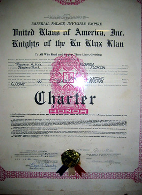 
                    This charter for a Florida chapter of the Ku Klux Klan was another item from the estate of the late Robert E. Miles that was included in a 2005 auction of Klan memorabilia in Howell, Mich. Miles, who died in 1992, was a grand dragon of the Ku Klux Klan and owned property near Howell. When Miles hosted rallies and meetings on his farm, many Klan members would come and stay at Howell hotels and patronize the town's businesses.
                                            (Desiree Cooper)
                                        