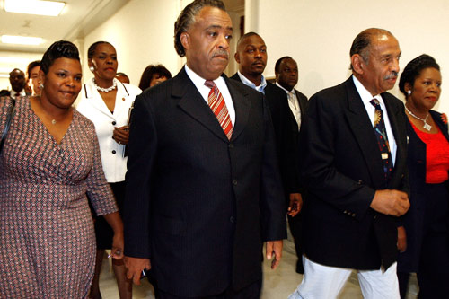 
                    "Jena Six" defendant Mychal Bell's mother Melissa (left to right), Michigan Congresswoman Carolyn Cheeks Kilpatrick, Rev. Al Sharpton, Bell's father Marcus Jones, House Judiciary Committee Chairman and Michigan Representative John Conyers and Texas Congreswoman Sheila Jackson-Lee walk to a Captiol Hill meeting to discuss the arrest and conviction of Mychal Bell and five other black students for the beating of a fellow white student.
                                            (Chip Somodevilla/Getty Images)
                                        