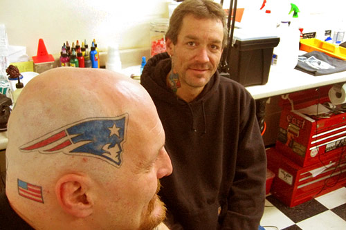 
                    Victor Thompson and his tattoo artist Gary Laroche in the House of Tattoos parlor in Laconia, N.H.
                                            (Shannon Mullen)
                                        