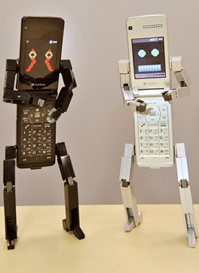 
                    Robot-shaped mobile phones produced by Toshiba displayed at the company's Tokyo headquarters.
                                            (Yoshikazu Tsuno / AFP/Getty)
                                        