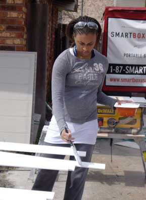 
                    Janel Knight primes baseboards in St. Bernard Parish, La.
                                            (Jenni Lawson)
                                        