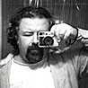 Alexander Thompson self-portrait with film camera