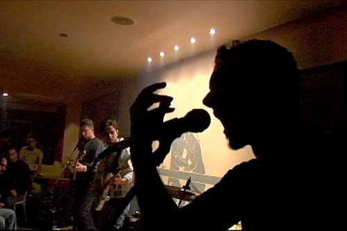 
                    Faisal, lead singer of Acrassicauda performing their original song "Underworld" at a performance in December of 2006.
                                            (VBS.TV/VICE Films)
                                        