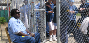 Inmate Bernard Moss holds the line at the gate.