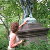Marge Wilson reads the inscription on a statue