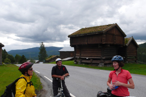 
                    My cousins Gerd Randi and Kjartan Ladstein join us for day three of the ride. The grass-topped roofs are typical in the Telemark region of Norway.
                                            (Leif Larsen)
                                        