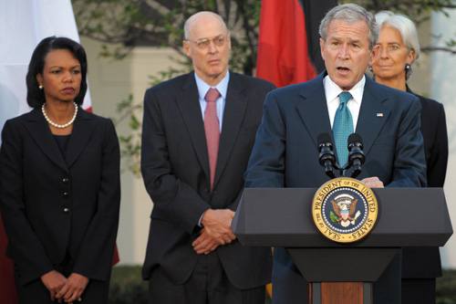 
                    President George W. Bush speaks, surrounded by G7 finance ministers and heads of international financial institutions. From left: U.S. Secretary of State Condoleezza Rice, U.S. Treasury Secretary Henry Paulson, French Finance Minister Christine Lagarde.
                                            (Mandel Ngan/AFP/Getty Images)
                                        