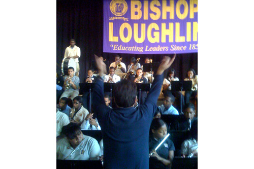 
                    Louis Maffei leads the Bishop Loughlin Memorial High School Band.  This year's marathon marks the 30th year they will be playing the theme to "Rocky" as runners pass.
                                            (Josh Rogosin)
                                        
