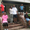 The Gilbert family on their old porch.