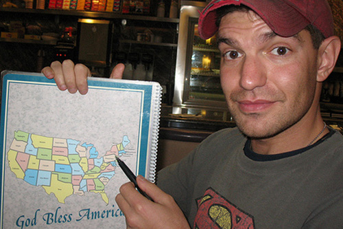 
                    BJ Hill with a map of the United States.
                                            (Dave Makar)
                                        