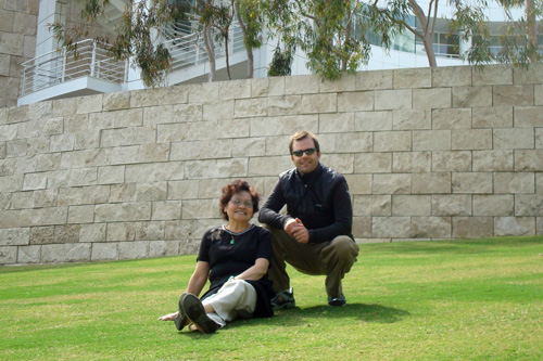 
                    Regina Mok and Charlie Schroeder take a break while visiting the Getty Center in Los Angeles. Mrs. Mok was thrilled to walk on the grass. She lives in Hong Kong, where many grassy areas are roped off.
                                            (Courtesy Charlie Schroeder)
                                        